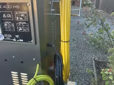 Rear setup showing high-pressure hose reel along with low-pressure and high-pressure chemical lines installed on a Nilfisk 400HS DTE system. Designed for flexible chemical application and improved usability on site.